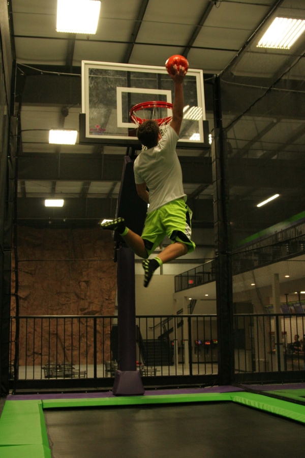 Boy about to Slam Dunk at Trampoline Basketball Park